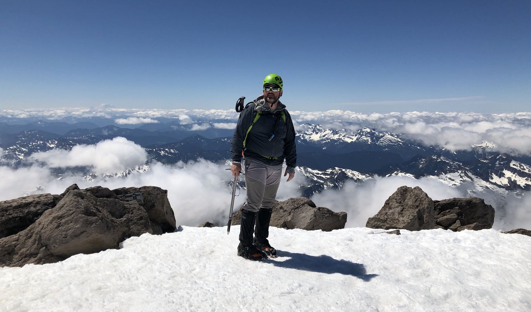 Royce on the summit of Glacier Peak above the clouds
