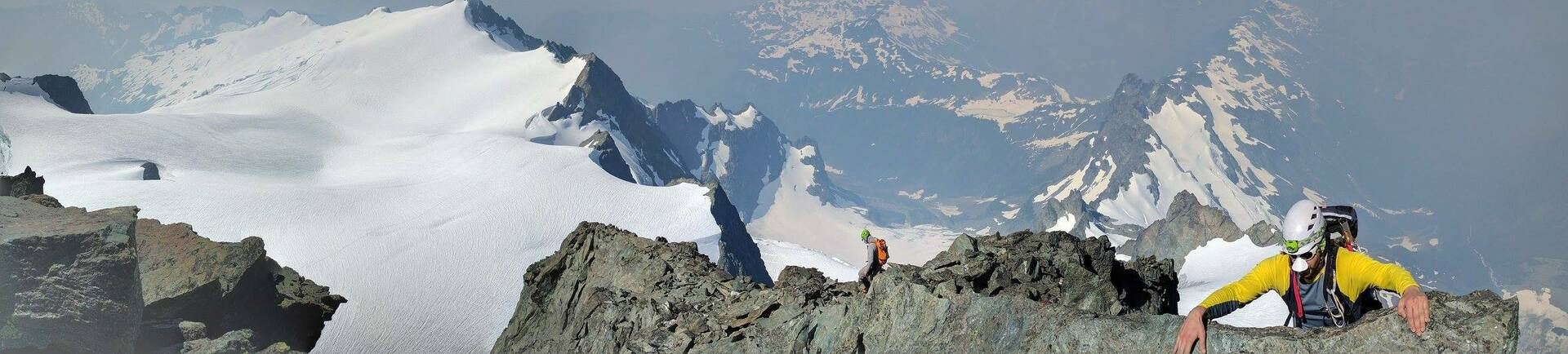 Climbers on an exposed alpine ridge